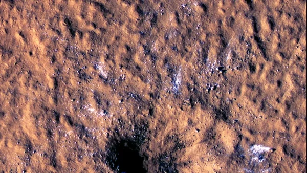 Meteor Strikes Mars, Unveils Massive Chunks of Ice