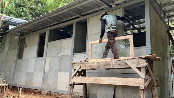 A group of engineers uses diapers to replaced sand to make a building