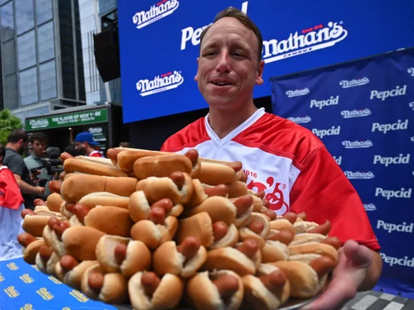 Man eats 47 hotdogs in 10 minutes(For free, and gets money back!)