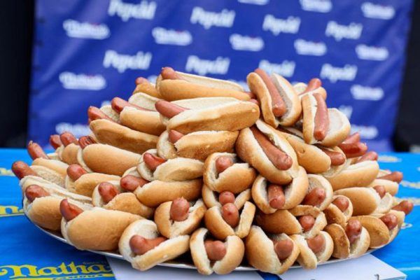 Australian man overcomes illness to eat 47 hot dogs in a minute