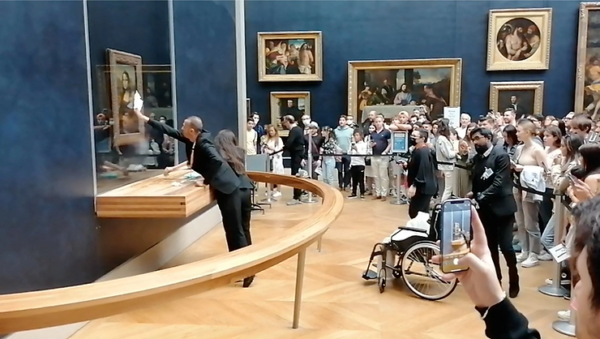 Man Disguised as Woman with Mobility Aid Throws Cake at the Mona Lisa; Gets Detained