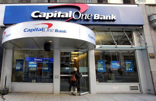 WOMAN DOWNLOADS INFORMATION OF CAPITAL ONE CUSTOMERS